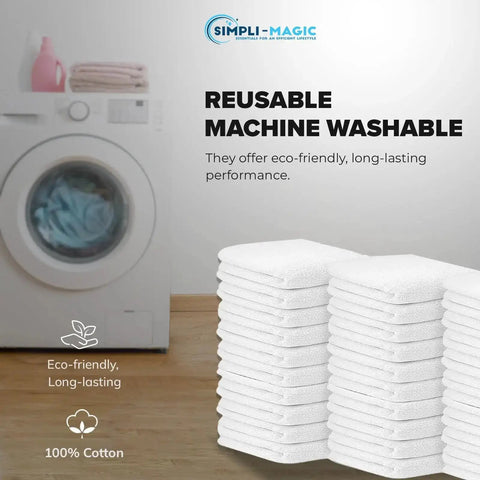 Stack of 60 white cotton terry towels 14x17 inches next to a washing machine for kitchen, bar, and restaurant cleaning use.