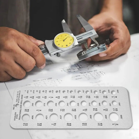 Drill Bit Gauge 29 Sizes Stainless Steel Wire Diameter Measuring Tool Handy With Hanging Hole For Accurate Fraction And Decimal Readouts From One Sixteenth To One Half Inch on a work table next to calipers.