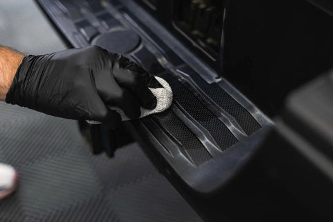 Applying Trim And Exterior Plastic Restorer With UV Protection Up To 2 Years 50 Ml on vehicle step trim