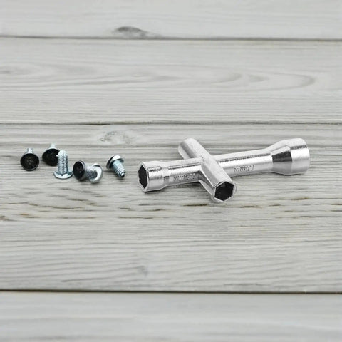 Pocket Sized Cross Socket Wrench for RC models and robot repairs with M2 M2.5 M3 M4 nuts and micro hex screws on wooden surface