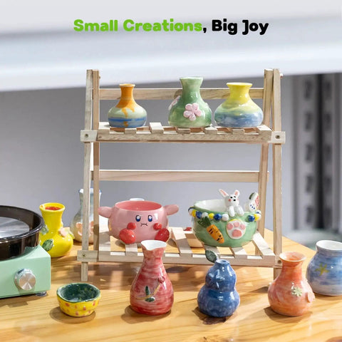 Mini Pottery Wheel Kit With 6 Inch Turntable Two Way Rotation Metal Frame And Removable Splash Tray Includes 18 Piece Sculpting Tools Ceramic Craft Machine Kid Friendly For Beginners with colorful clay pots displayed on wooden rack.