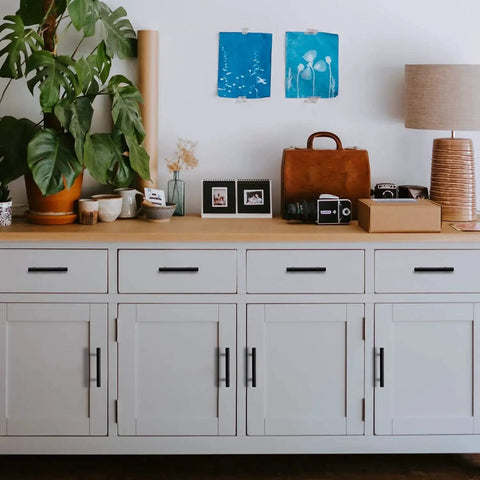 White cabinet with 32 pack 7.38 inch matte black cabinet pulls, stainless steel handles, 5 inch center to center holes, modern design.