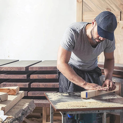 Craftsman in workshop working on wood pieces with Pattern Flush Trim Router Bit Set With Top Bearing, 4 Pc Kit for veneer edging.