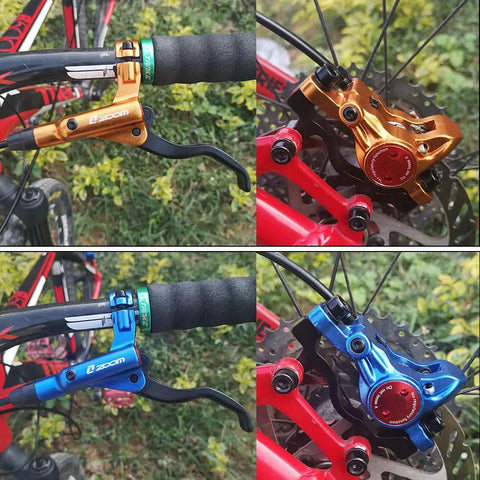 Zoom HB-875 hydraulic disc brake set for mountain bikes; front & rear calipers in orange and blue variants.