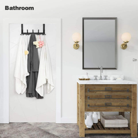 Over-the-door towel rack with 15 black metal triple hooks mounted on a white bathroom door