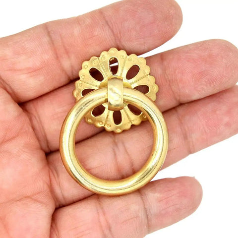 Close-up of a Set Of 6 Vintage Gold Brass Ring Pulls With Hollow Dome Base Flower Like Design For Cabinets