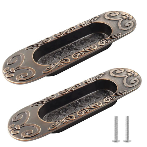 Two Pack 4.13 Inch European Recessed Flush Pull Handle Set In Stainless Steel With Antique Copper Finish, decorative design visible.