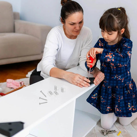 Woman and child installing Miniature Decorative Box Hinges Set 100 Pcs Silver 8x10mm With Nails for cabinet assembly.