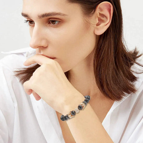 Woman wearing bracelet with Golden Crown Beads Set 11x7mm Large Hole Crystal Cubic Zirconia Pave King Crown Charms on wrist