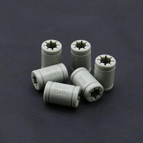 LM8UU Linear Bearing Set 8Mm Inner Diameter, 15Mm Outer Diameter, 24Mm Length For DIY 3D Printer - 10 Pack shown lying on surface.