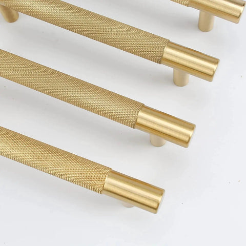 Four Pack 3 Inch Solid Brass Cabinet Pulls In Brushed Gold Finish, close-up view showing texture and details of heavy duty drawer handles.
