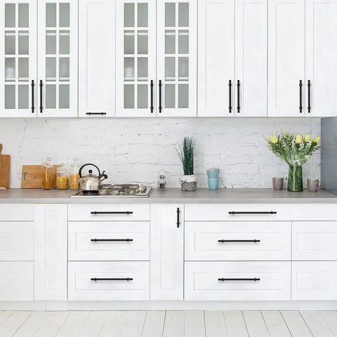 Matte Black 25 Pack Cabinet Handles 3 Inch Hole Centers 5 Inch Overall Length installed on white kitchen cabinets