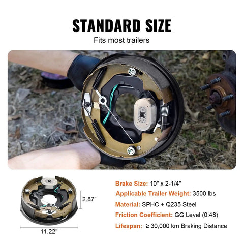 Electric trailer brake assembly with backing plate and wiring, 10 x 2-1/4 in, held by gloved hands.