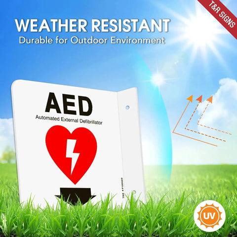 AED Sign With Down Arrow 6 By 6 Inch Acrylic Wall Sign 2 Pack Pre Drilled Holes Includes Matching Screws Easy Mount For Office And Business Use Durable UV Protected Waterproof Sign displayed in a sunny outdoor environment, highlighting its weather-resistant feature.