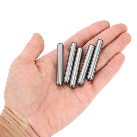 5/16 Inch Dowel Pins, 2 Inch Length, Heat Treated Alloy Steel For Extra Hardness, Bright Finish, shown in hand, five pins