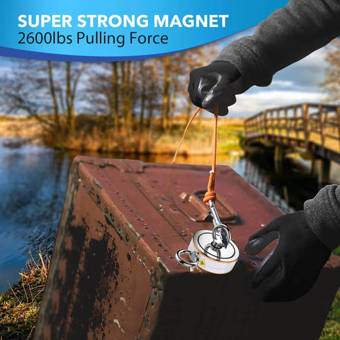 Double Sided Magnetic Fishing Kit With Beast 2600 Lb Pull in use on metal object by lake with rope and gloves