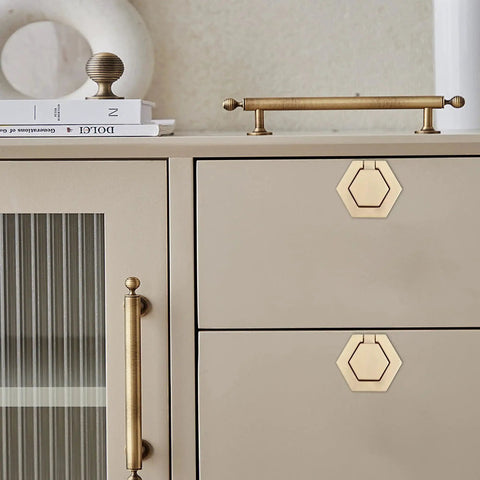 Two Pack Zinc Alloy Flush Mount Cabinet Pull Handles Gold Finish Flat Ring Style installed on beige cabinet