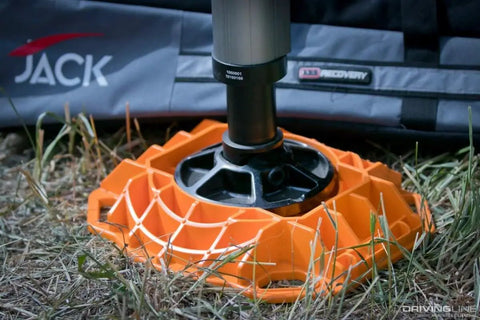 Beefy Heavy Duty Jack Base For Off Road Jacks, 15,400 Lb Load Capacity, Low Profile HDPE Construction on grass.