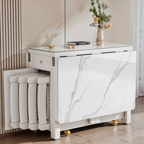Modern white marble console table with folding stools stored underneath in a stylish living room setting, flowers on table.