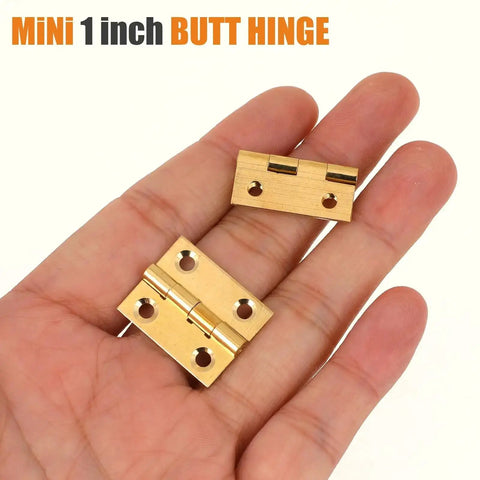 Hand holding two mini 1 inch solid brass butt hinges from Ten Pack Mini Solid Brass Hinge For Jewelry Box Cabinet Drawer Butt Hinge One Inch Small Hinges For Wooden Box Screws Included Corrosion Resistant Durable Hardware