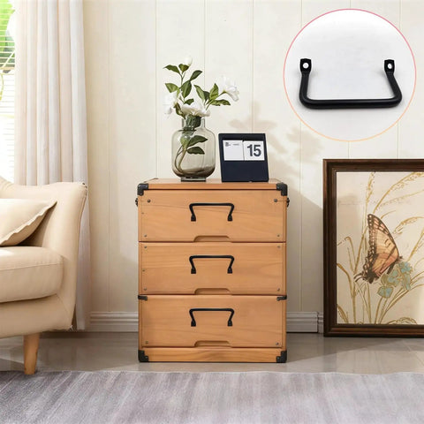 Image of wooden chest with set of 4 black tableware tray handles and serving tray pulls shown on drawer in living room.