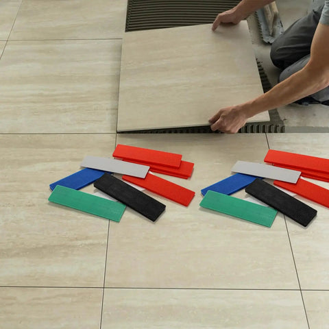 Bulk 300 Piece Plastic Flat Shim Set For Leveling And Tile Installation with color-coded shims on tiled floor