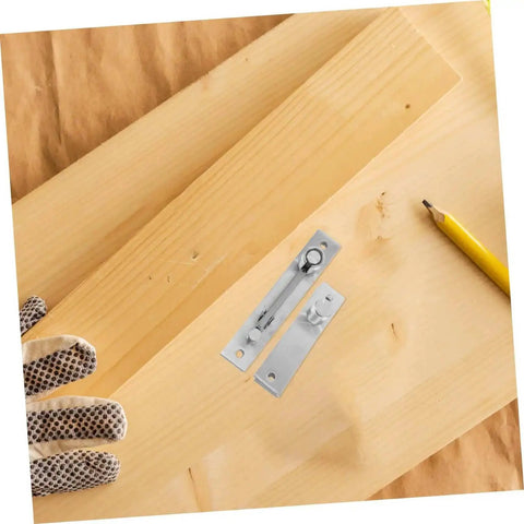 Close-up of hidden pivot hinge set on wood surface with pencil, highlighting 180-degree design for concealed applications in doors and cabinets.
