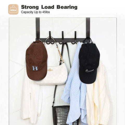 Over-the-door towel rack with 15 triple hooks in black metal; mounted on white door with hats and bags