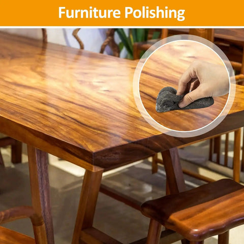 Hand using Extra Fine 0000 Steel Wool Pads Set For Wood Glass Polishing 15 Pack on wooden table surface