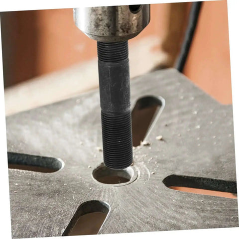 Hydraulic Heavy Duty Workhorse Knockout Punch Driver Kit for Metal Sheets in use punching a clean hole in a metal sheet