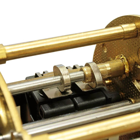 Close-up of brass and steel components showing part of the assembly for Brass Round Rods Set For Knife Making And Diy Projects, 24 Pcs With Assorted Diameters From 1.5 Mm To 8 Mm And 100 Mm Length, Ideal For Dowel Pins, Drift Punches, Lathe Bar Stock, Model Craft And Ship Builds.