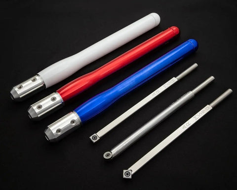 Turning Acrylic and Resin on a Wood Lathe Made Easy With This 3 Tool Carbide Set for Hybrid Projects Featuring 9 Inch Tools and 12 Inch Colorful Handles USA Made Shearing Cut Tools for Clean Consistent Results. Stainless steel tools with red, white, and blue handles on black background.