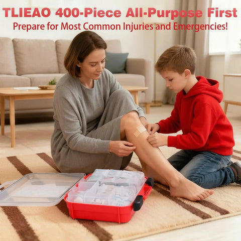 Child bandaging woman's leg using All Purpose 400 Piece First Aid Kit With Dual Layer Wall Mount Organizer, open kit visible in room.