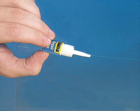 Person using the Windshield Repair Kit From Rain X for Chips Cracks Bulls Eyes Stars And Laminated Glass With Advanced Resin Formula Color Clear Great For Multiple Repairs.