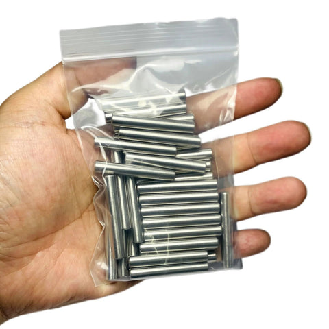 35 Pieces 6mm By 40mm Dowel Pins Set In Stainless Steel 304 For Shelves, Bunk Beds And Wood Projects shown in a hand