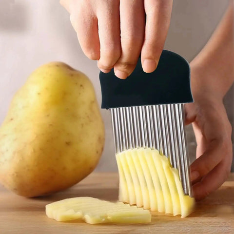 Person using Stainless Steel Crinkle Cutter Wavy Fries Slicer And Vegetable Chopper 2 Pack Black Heavy Duty Blade Ergonomic Non Slip Handle For Potatoes Carrots Fruits Durable Kitchen Tool For Home Chefs on a potato
