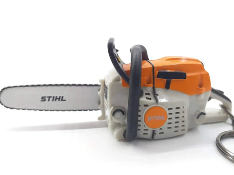 Battery Operated Chainsaw Keyring With Realistic Sound Effects, orange mini tool charm on white background.