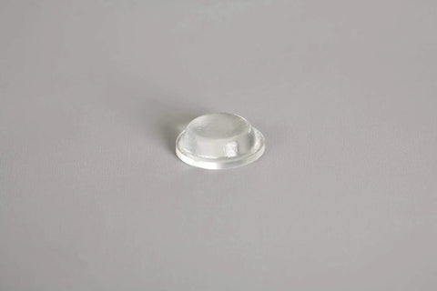 Clear Self Adhesive Cylindrical Bumper Feet One Half Inch Dia 0.14Inch 50 Pack, close-up of single bumper on gray surface