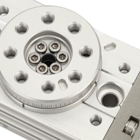 Pneumatic rotary actuator with silver aluminum housing, circular mounting flange and multiple bolt holes (front view).