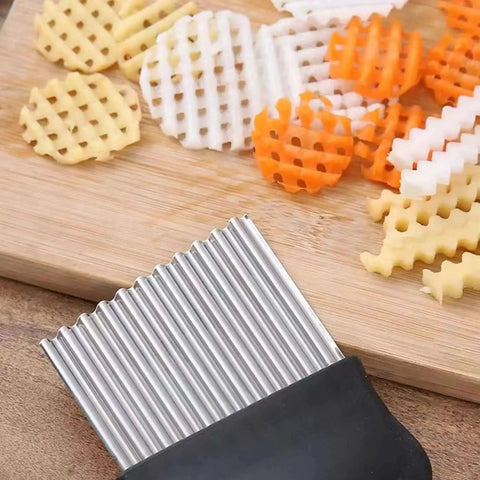 Stainless Steel Potato Masher With Integrated Design And Crinkle Cutter Easy Wide Grip Kitchen Tool For Mashing Potatoes Beans Vegetables Fruits Avocado And Meat Your Go To 304 Grade Stainless Steel Masher cutting crinkle shapes on board
