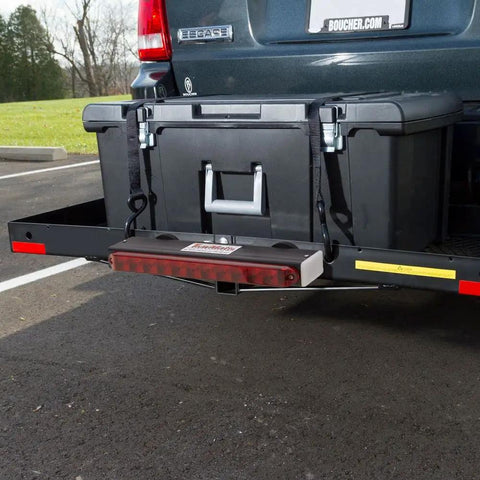 Installed black hitch-mounted cargo carrier with magnetic LED tail light bar on the rear of an SUV.