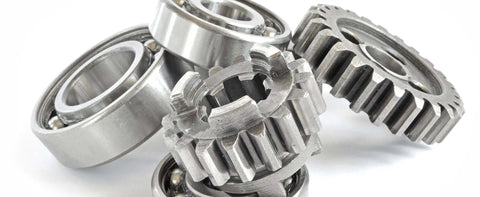 Close-up of metal bearings and gears for industrial machinery applications.