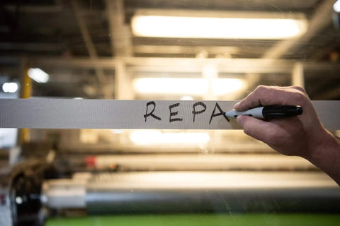 Hand writing on silver duct tape labeled REPA, highlighting Multi-Use Silver Duct Tape 1.88 in x 60 yd x 7 mil, 1 Pack, Contractor Grade.