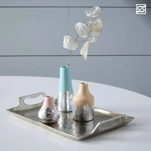 Three silver-gilded vases on a metal tray using Metal Leaf Adhesive For Gold Silver Copper Gilding Water Based Brush On 2 Oz.