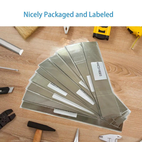 30 Piece 304 Stainless Shim Stock Set 1 Inch By 6 Inch With 10 Thicknesses displayed on workbench with tools