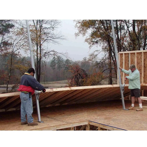Workers using Telescoping Wall Jack Pair For Sheathed Walls Up To 70 Feet And 16 Foot Lift on construction site