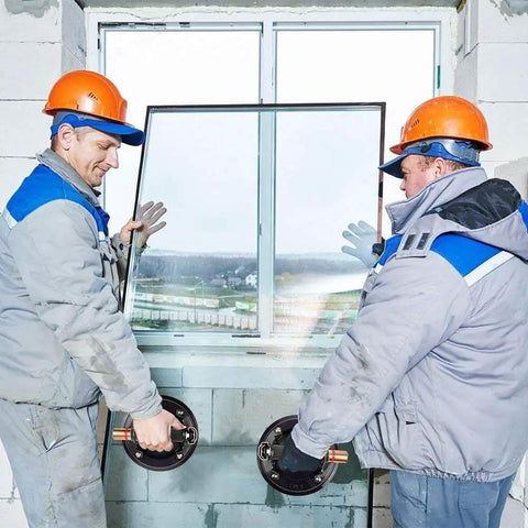 Two workers installing a window using 8 Inch Glass Vacuum Lifter With Handle For Granite Glass And Stone Heavy Duty Suction Cups 240 Lbs Load Capacity