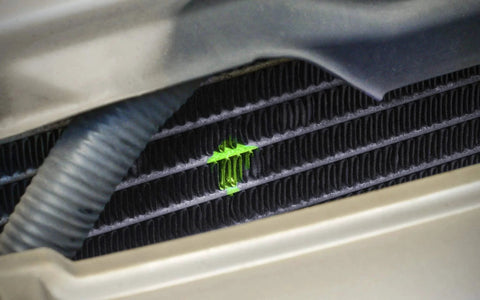 Ultraviolet Fluorescent Automotive Leak Detection Dye revealing leak in car radiator. 1oz Bottle Made In USA From TRACER LEAKFINDER LF3001CS.