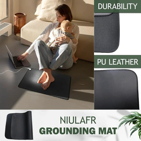 Woman using laptop with baby on All In One Grounding Mat Kit With 15Ft Cord For Foot Mats Computer Desk And Sleep Mat Pet Friendly Super Soft And Cozy Polyurethane Surface