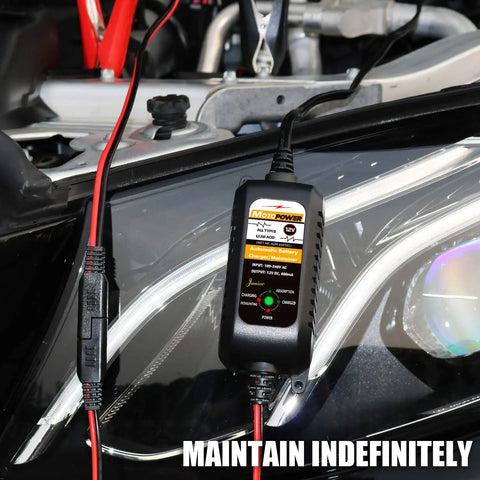 All Weather 12V Battery Charger Maintainer And Desulfator With Automatic Trickle Charge For Cars Boats And Powersports 800mA Lead Acid AGM Gel Cell Ready By MOTOPOWER MP00205A connected to a car battery.